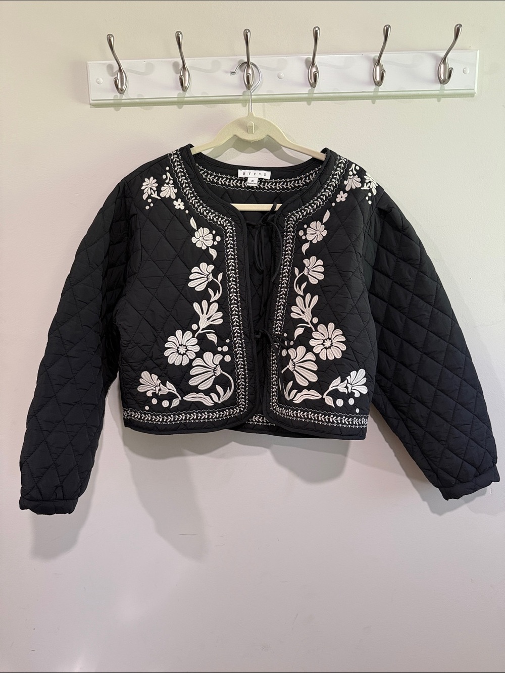 HYFVE Woman’s Black Quilted Puffer Jacket with White Floral Embroidery